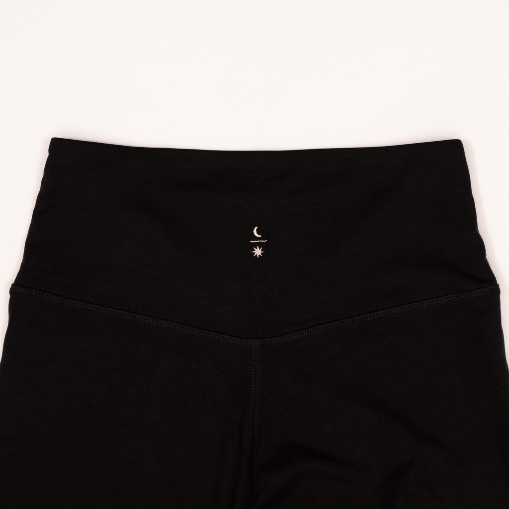 Ainé leggings back view showing embroidered logo detail